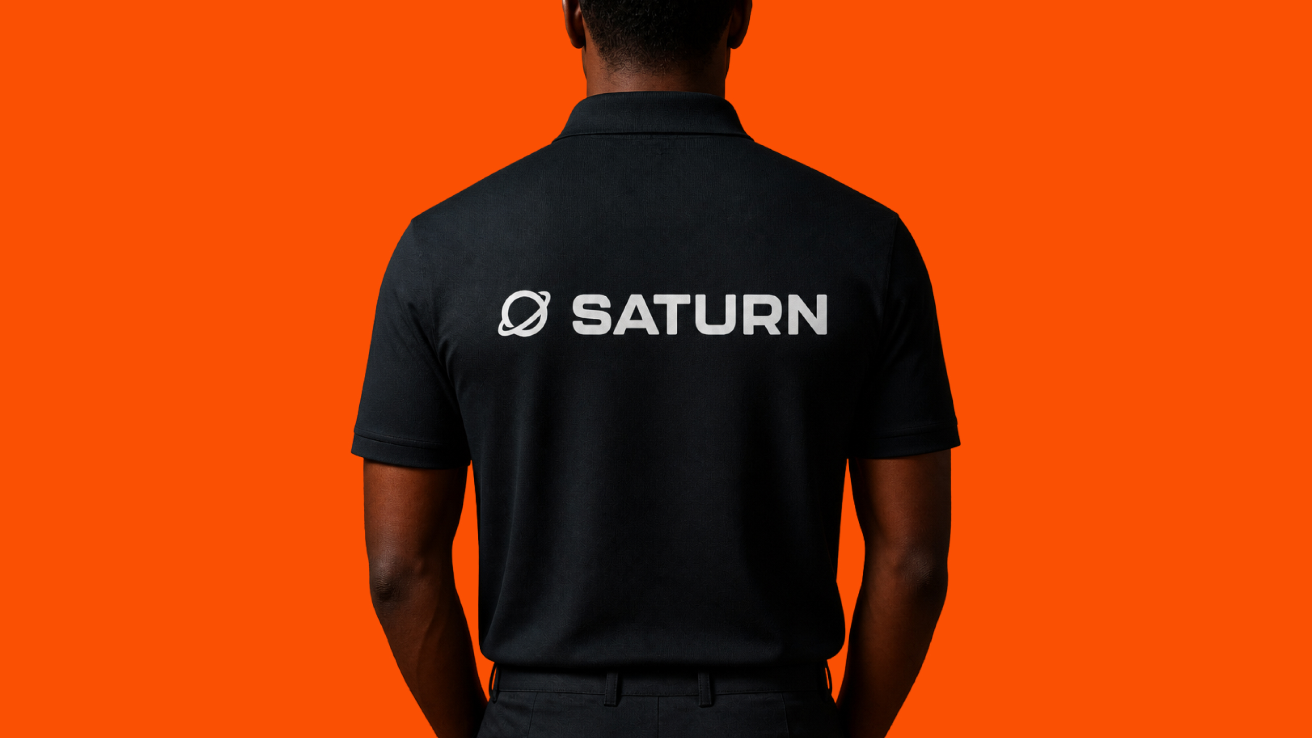 Saturn logo embroidered on a branded polo shirt